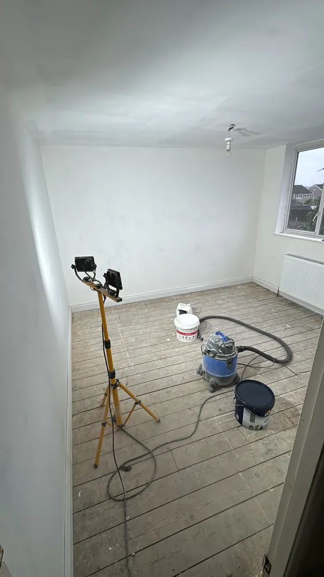 Room during preparation with exposed floorboards
