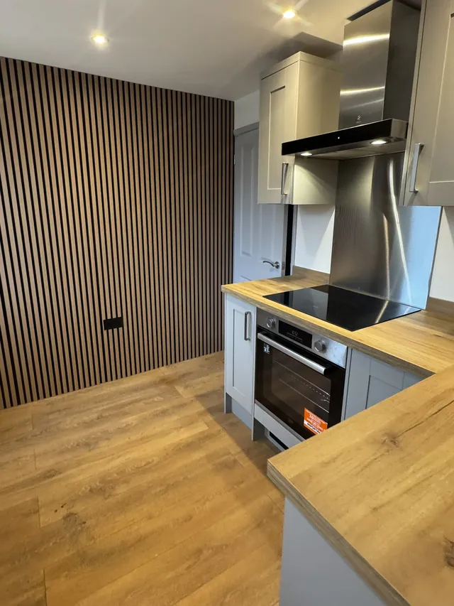 Slatted feature wall and the kitchen cooking area