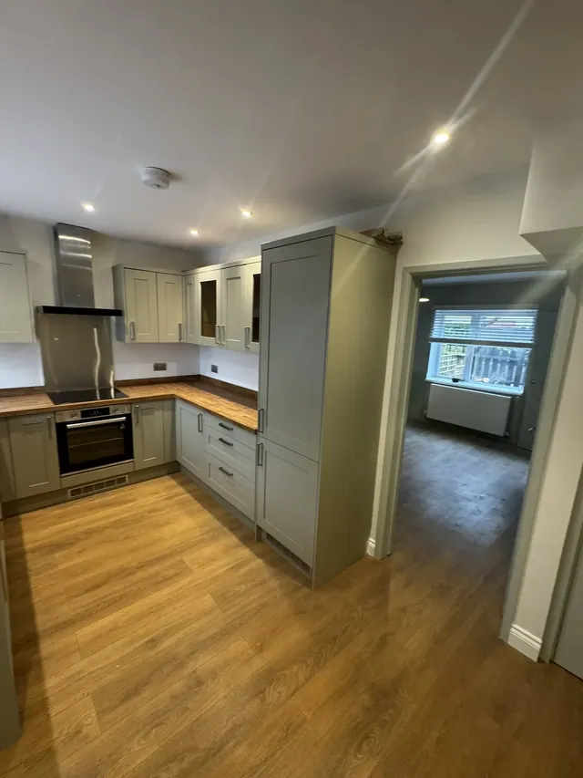 Fitted kitchen opening towards the adjoining living room