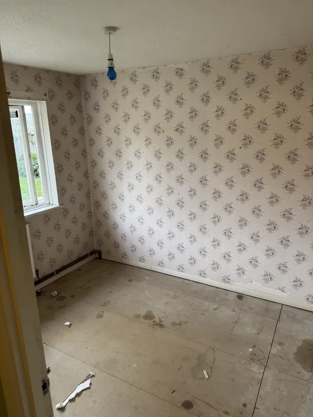 Room with old wallpaper before redecoration
