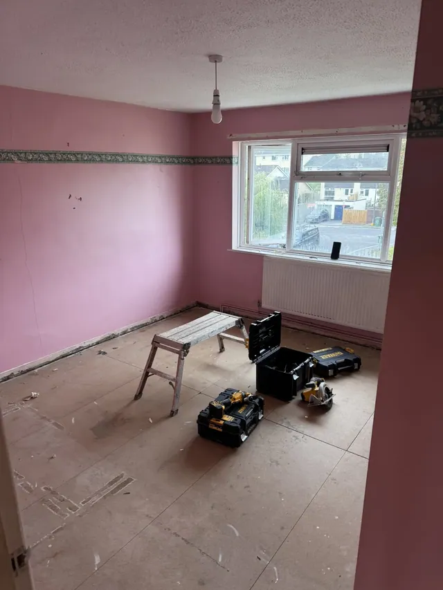 Pink-painted room before refurbishment