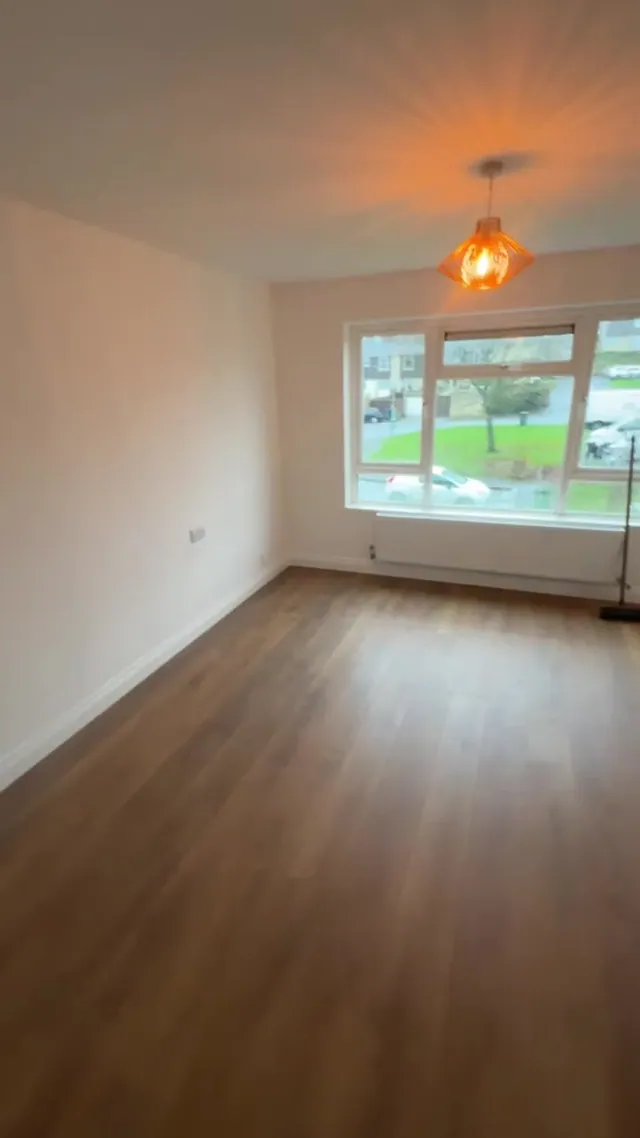 Later view of a decorated living area with new floor finish