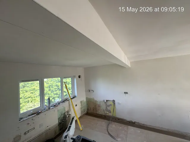 Opened-up kitchen area after plastering and surface preparation