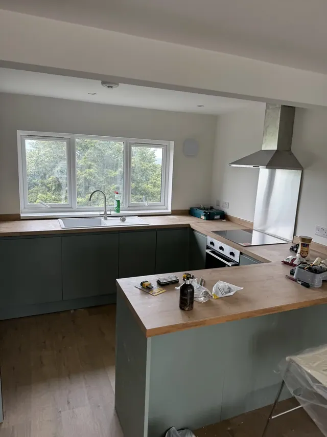 Kitchen cabinets, sink and cooking area during finishing
