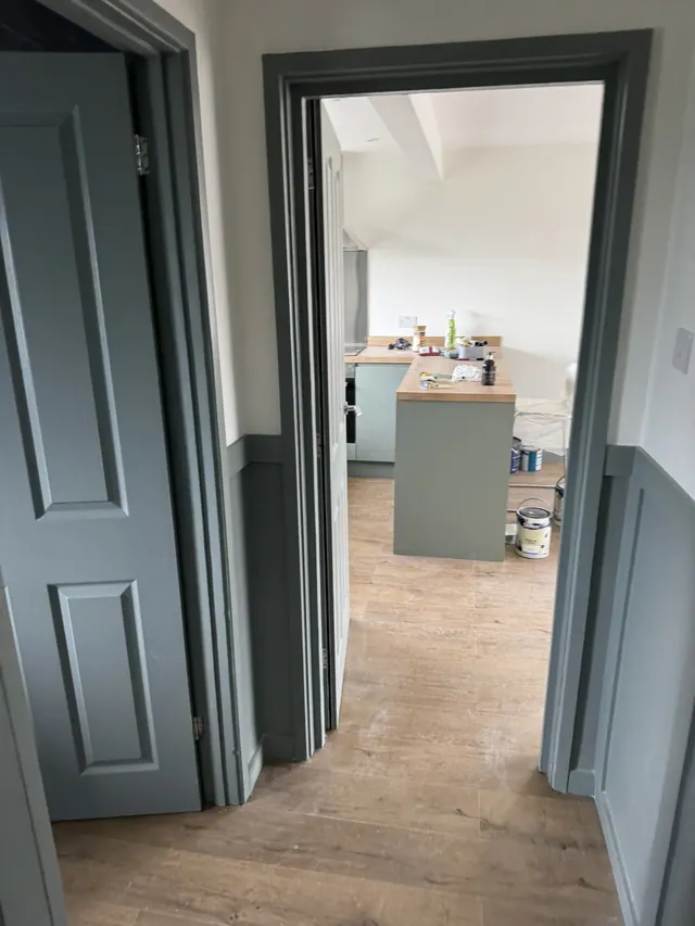 View from the decorated hallway towards the kitchen