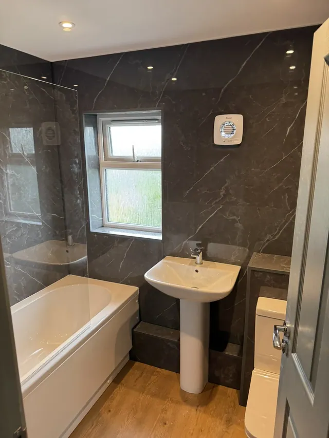 Bathroom fittings and marble-effect wall panels