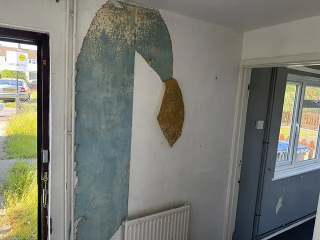 Original hallway and wall finishes before refurbishment