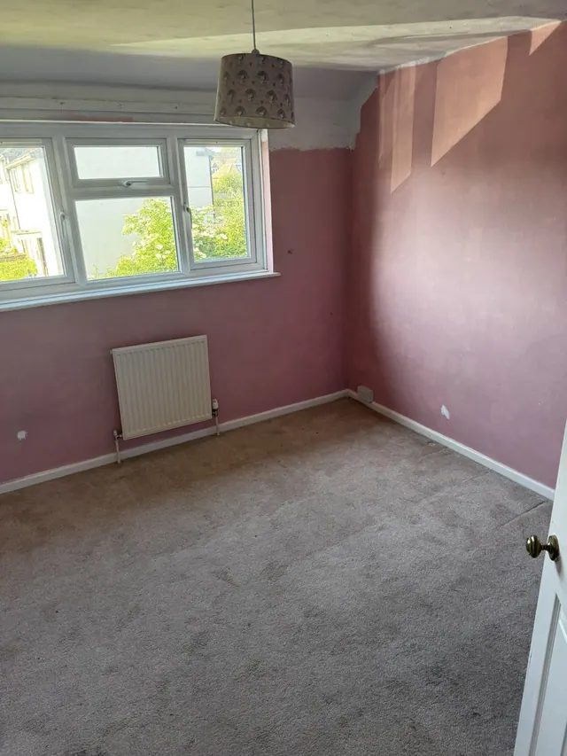 Bedroom with the original wall and floor finishes