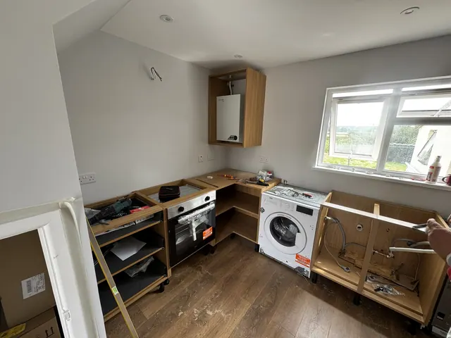 Kitchen cabinets and appliances during installation