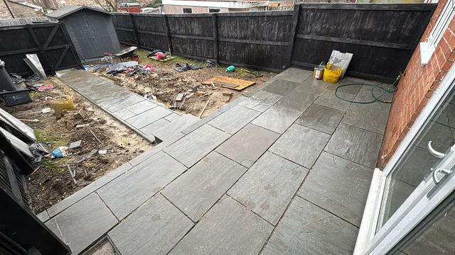Patio slabs being laid during the external work