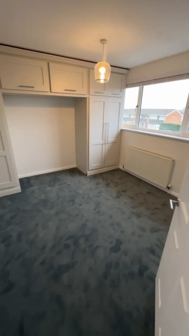 Decorated bedroom with fitted carpet and refreshed wardrobe doors
