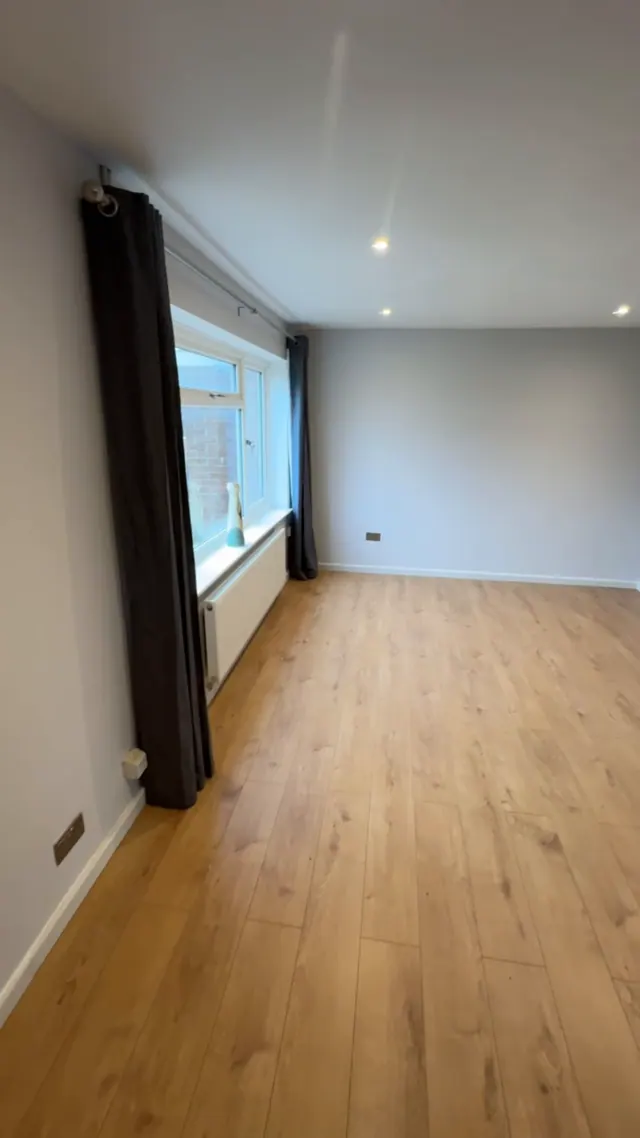 Refreshed living room with a coordinated floor finish